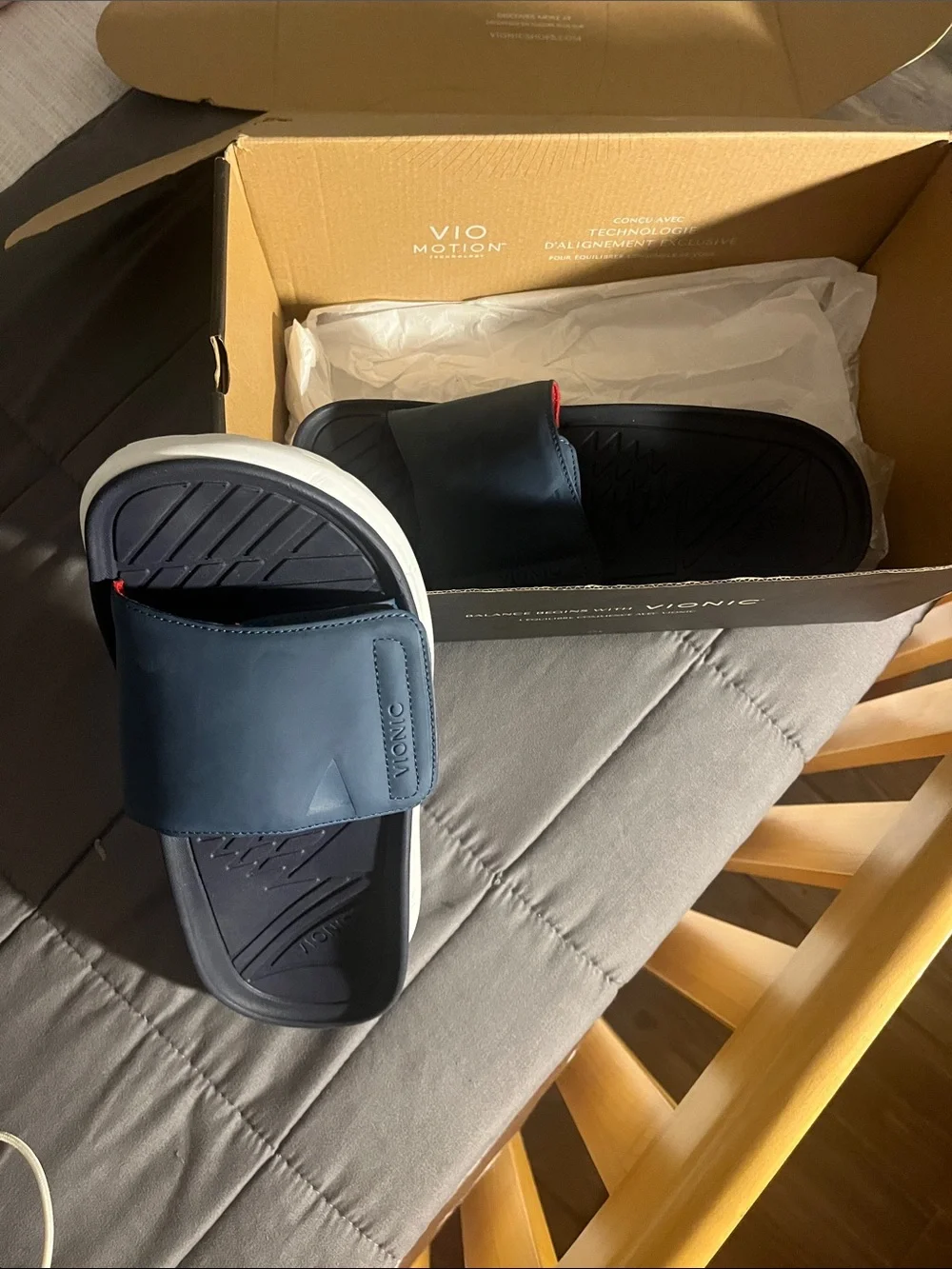 Vionic Rejuvenate Recovery Slides in navy blue.